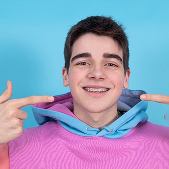 teen boy with traditional braces  
