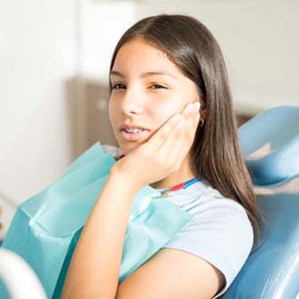 Teen visiting for emergency orthodontic treatment in Milford