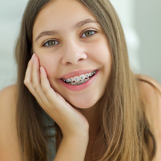 Young woman with self ligating braces smiling