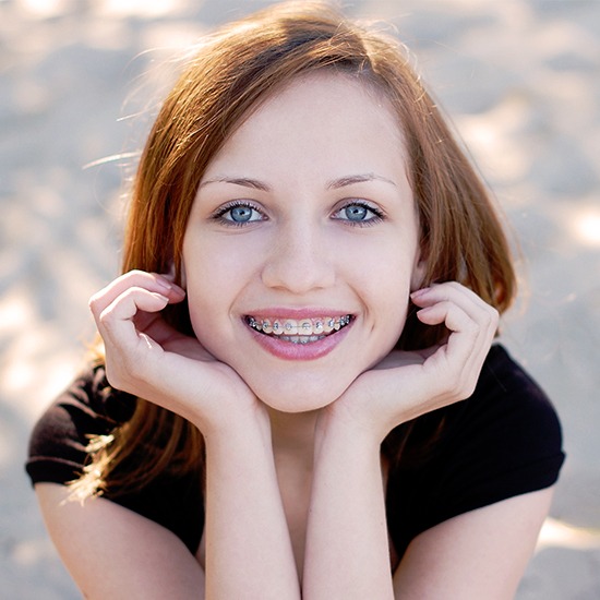 Smiling woman with traditional braces