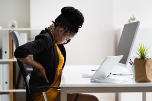 Woman corrects her posture after visiting Milford orthodontist